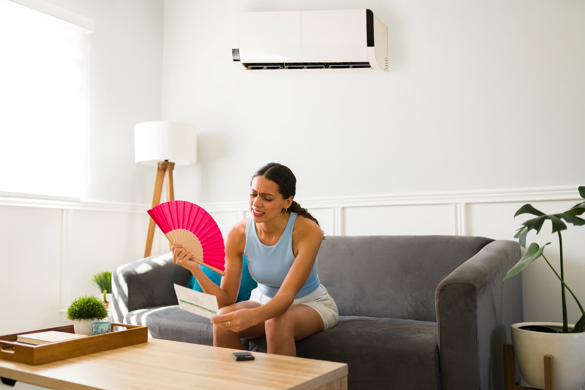 Indoor Climate Experts | Woman reading high utility bill